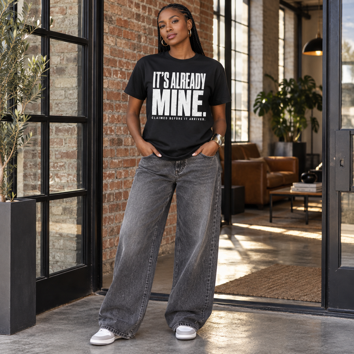 Woman modeling the black It's Already Mine tee