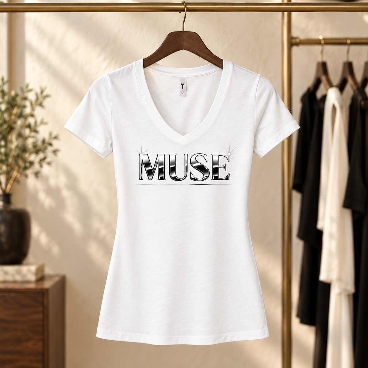 White Muse V-neck tee hanging in a boutique