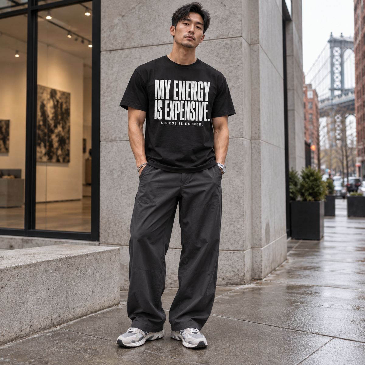 Man modeling the black My Energy Is Expensive tee