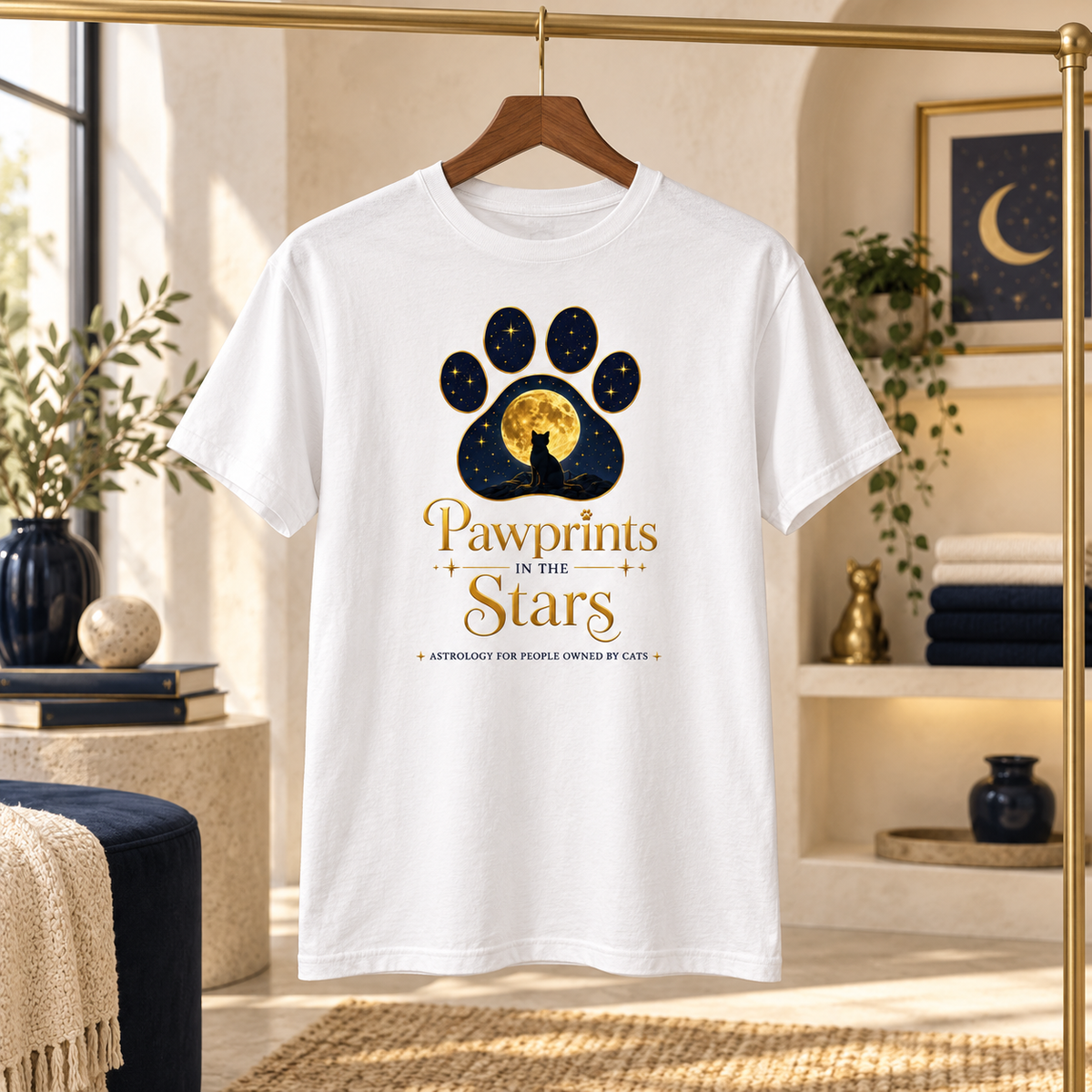 Pawprints in the Stars cats unisex T-shirt displayed in a boutique