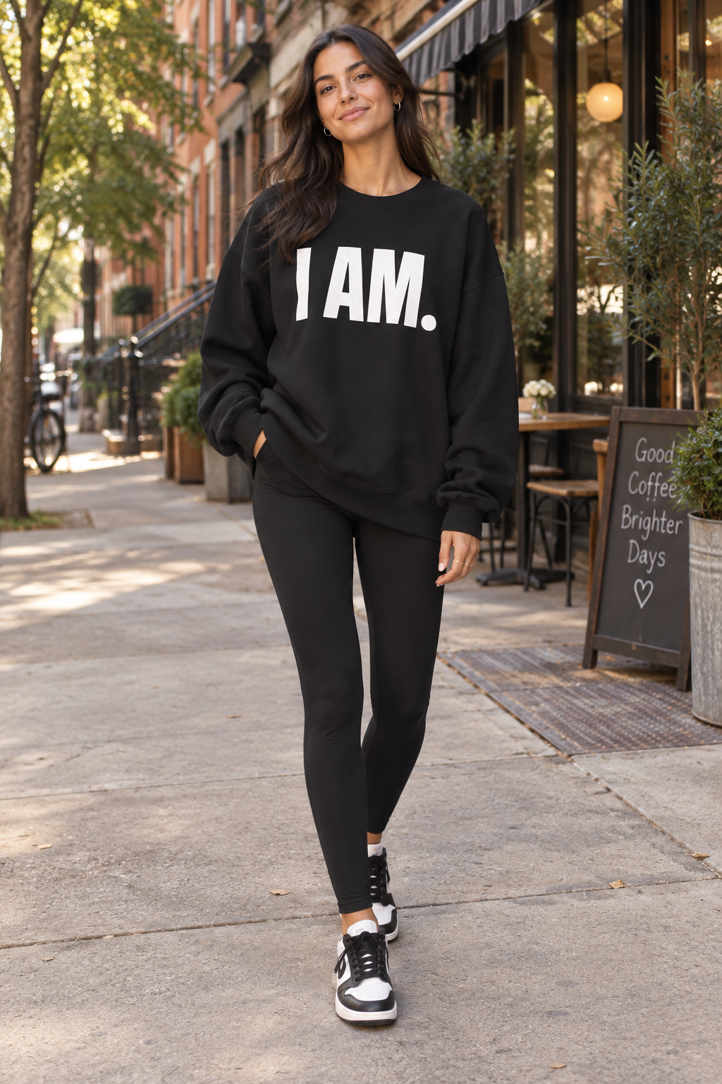 Woman wearing the black I AM. statement crewneck sweatshirt