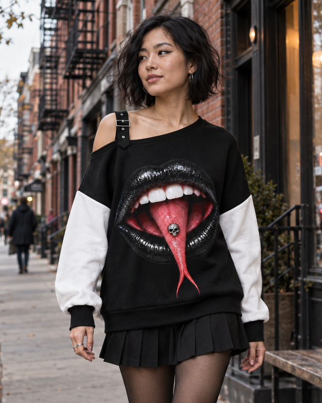 Model wearing the black and white SHARP TONGUE off-the-shoulder sweatshirt
